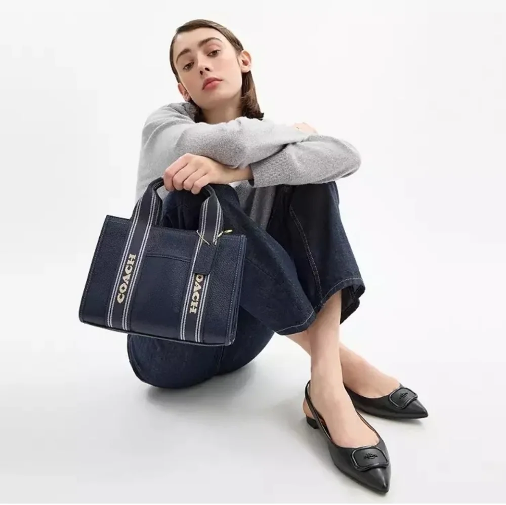 Coach Leather Smith Tote 24 with Striped Handles.